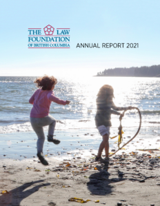 Two young girls play on a sunlit beach